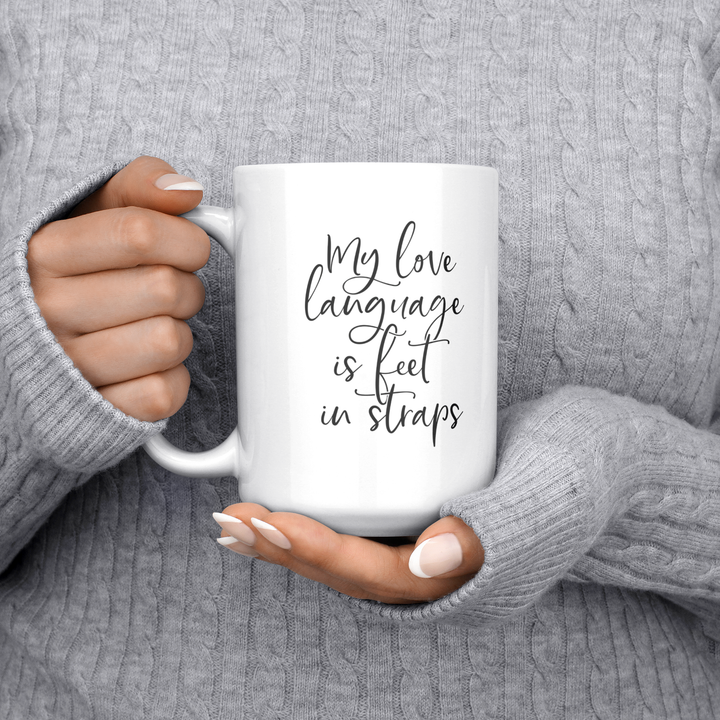 Love_Language_Is_Feet_Straps_Mug_15ozWhiteMugLifestyleLHChest_Mockup.png