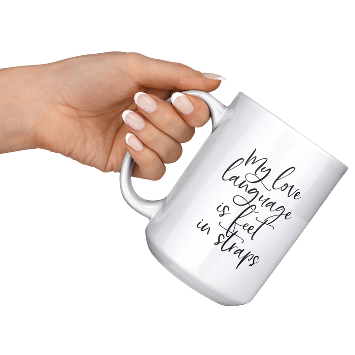 Love_Language_Is_Feet_Straps_Mug_15ozWhiteMugLifestyleLHRaisedAngle_Mockup.png
