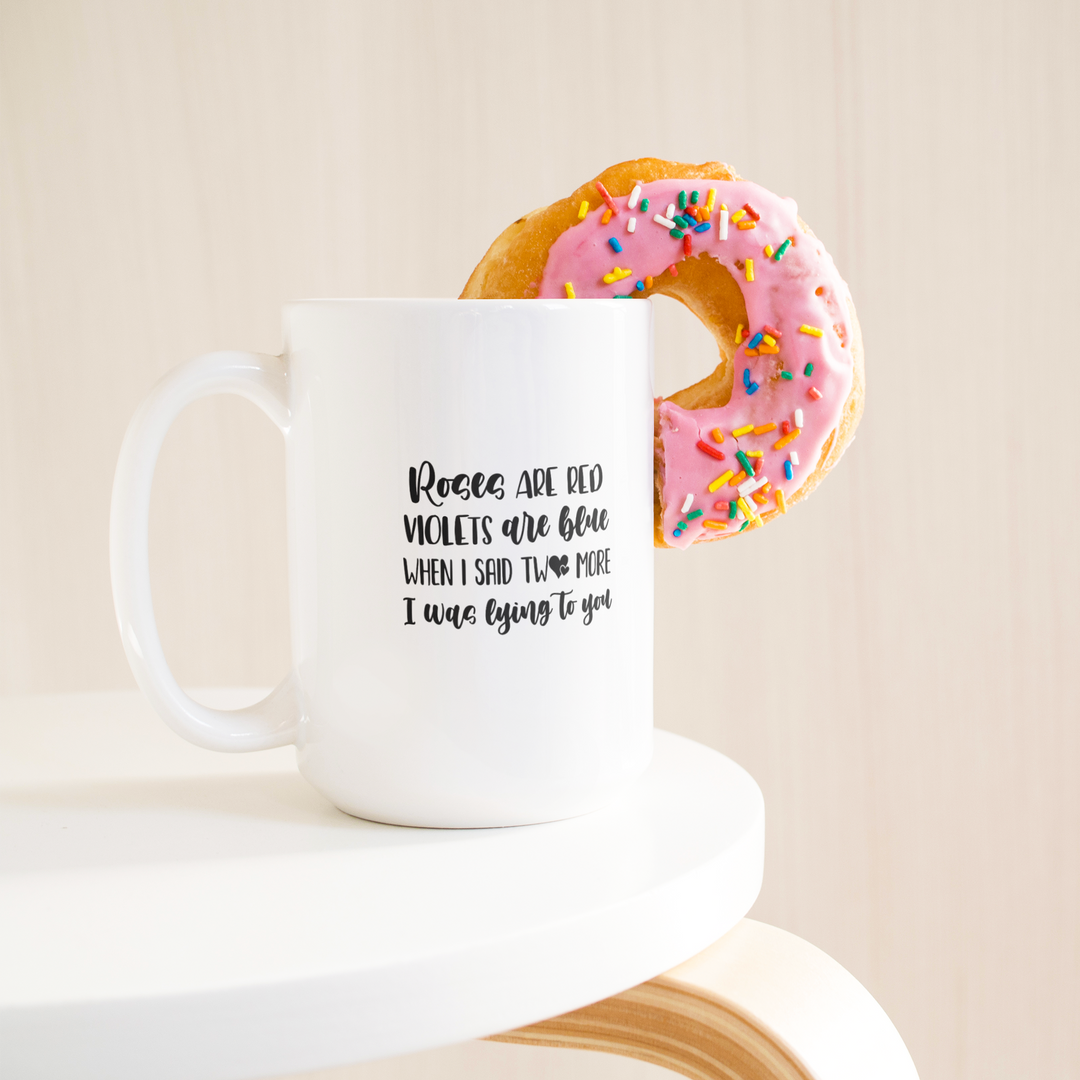 Lying_To_You_Coffee_Mug_15ozWhiteMugLifetsyleDonutLH_Mockup.png