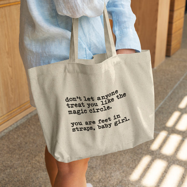 Treat_You_Like_Magic_Circle_Tote_Bag_CottonTote_L_WomanDigging_Mockup.png