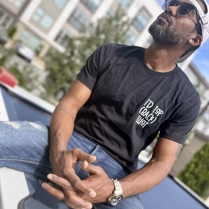 Man wearing a unisex heather black shirt from The Movement Shop that says "I'd Tap (Back) That"
