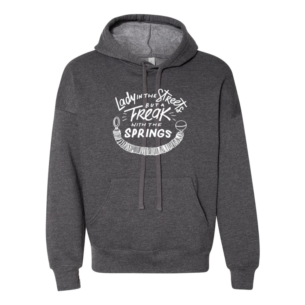 A deep heather unisex hoodie grey sweatshirt that says "Lady In The Streets But A Freak With The Springs" in white text with a pilates spring under the text.