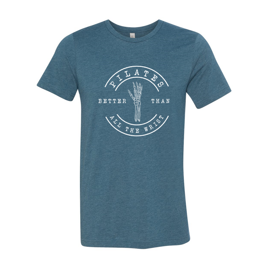 Heather teal unisex crew t-shirt with the words "Pilates better than all the wrist" in white text. There is a skeleton wrist incorporated into the text.