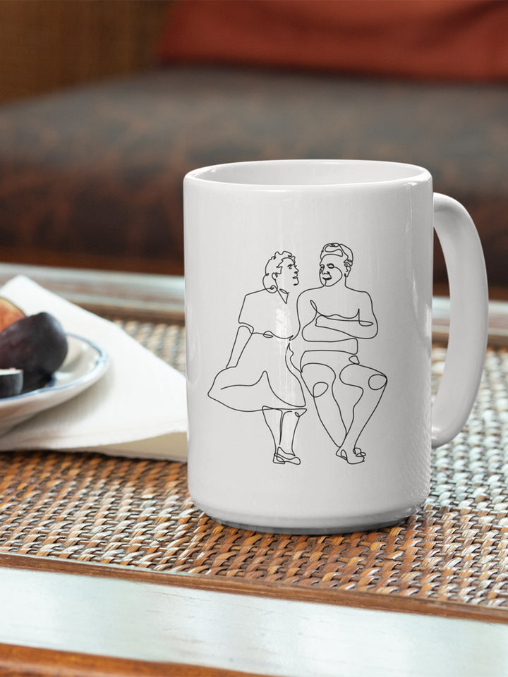 15 oz white coffee mug that with a single line drawing of Clara Pilates and Joe Pilates.