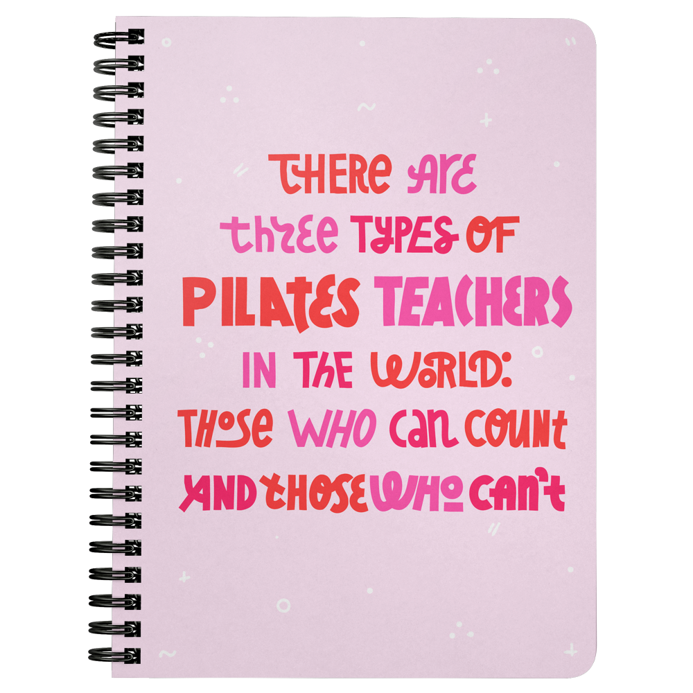 Pink spiral bound notebook that says 'there are three types of pilates teachers in the world: those who can count and those who can't