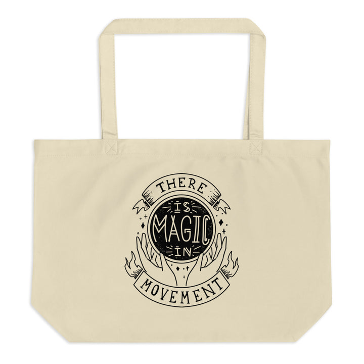 Canvas tote with handles that says "There is Magic In Movement" in black text. It is designed to look like crystal ball.