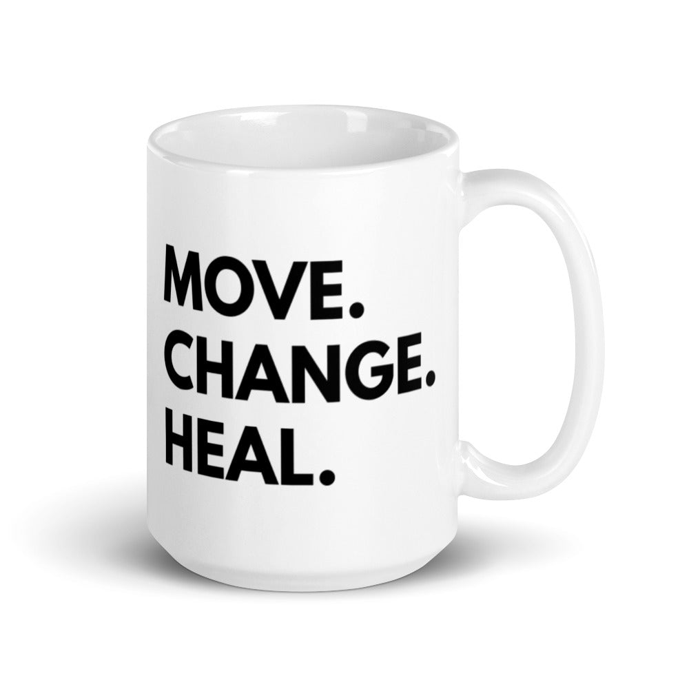 15 oz mug  that says Move. Change. Heal. in black text