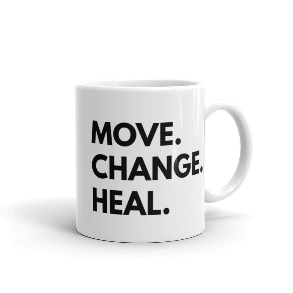 11 oz mug  that says Move. Change. Heal. in black text