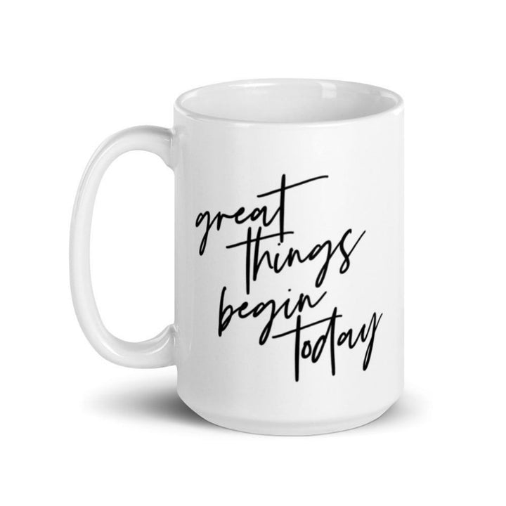 White 15 oz coffee mug that says "Great things begin today" in black text. The quote is a nod to the Joseph Pilates Quote, "every moment of our lives can be the beginning of great things"