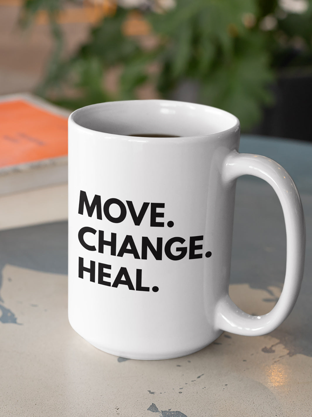 15 oz mug  that says Move. Change. Heal. in black text