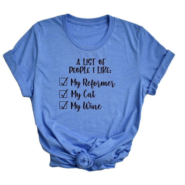 A heather columbia blue unisex crew neck t-shirt that says "A list of people I like: My reformer, A Cat, my wine".