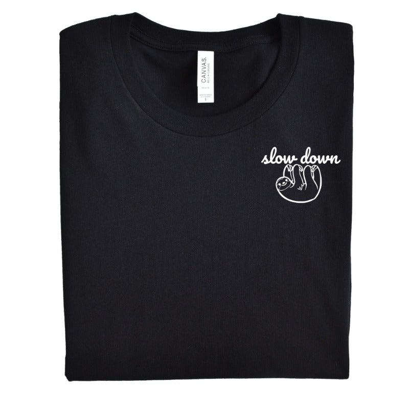 Folded Heather Black Unisex Crewneck T-Shirt that has the text "slow down" in white script over a white sloth on her left chest logo.