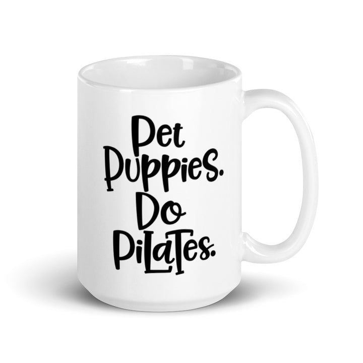 15oz white mug that has the words "Pet Puppies. Do Pilates" on the front.