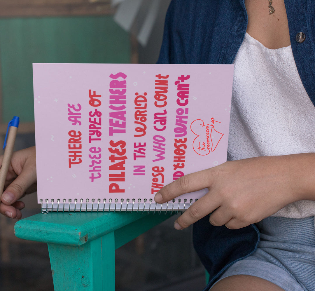 Woman writing in a notebook that says "there are three types of pilates teachers in the world: those can count and those who can't"