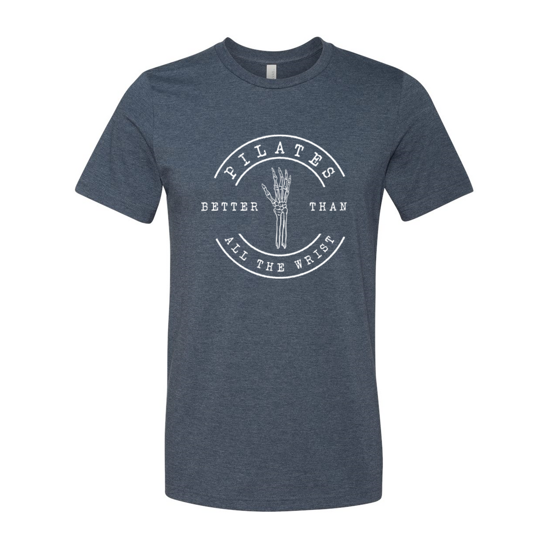 Heather Navy unisex crew t-shirt with the words "Pilates better than all the wrist" in white text. There is a skeleton wrist incorporated into the text. 