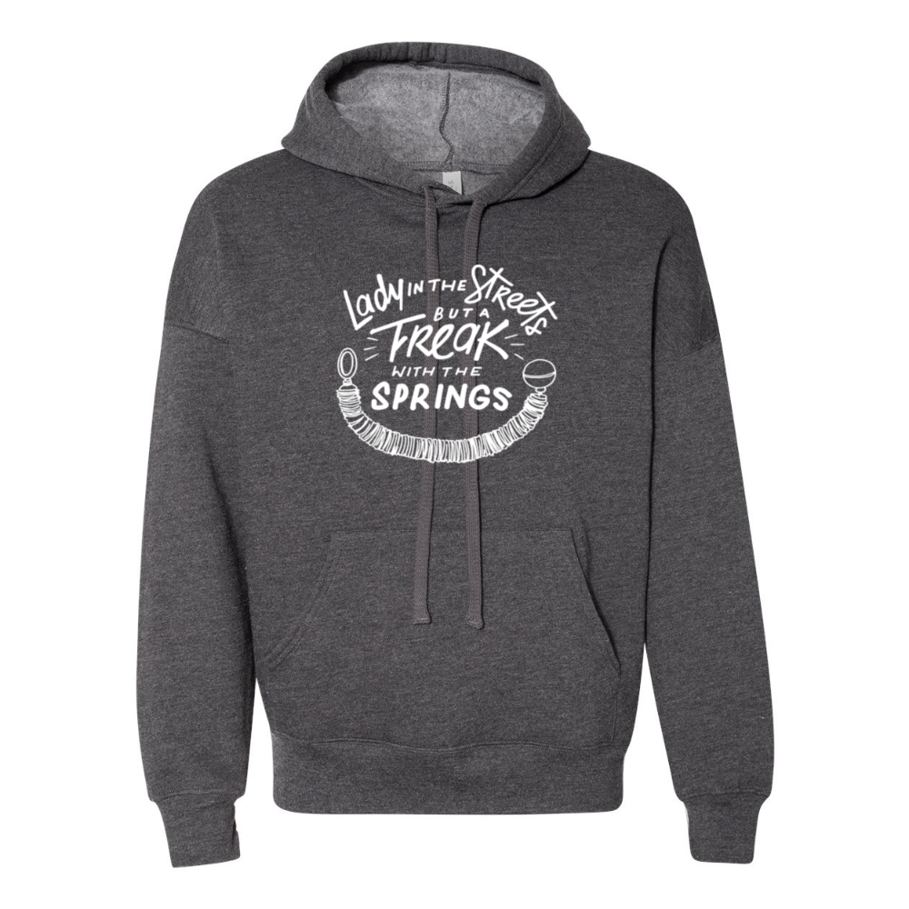 A deep heather unisex hoodie grey sweatshirt that says "Lady In The Streets But A Freak With The Springs" in white text with a pilates spring under the text. 