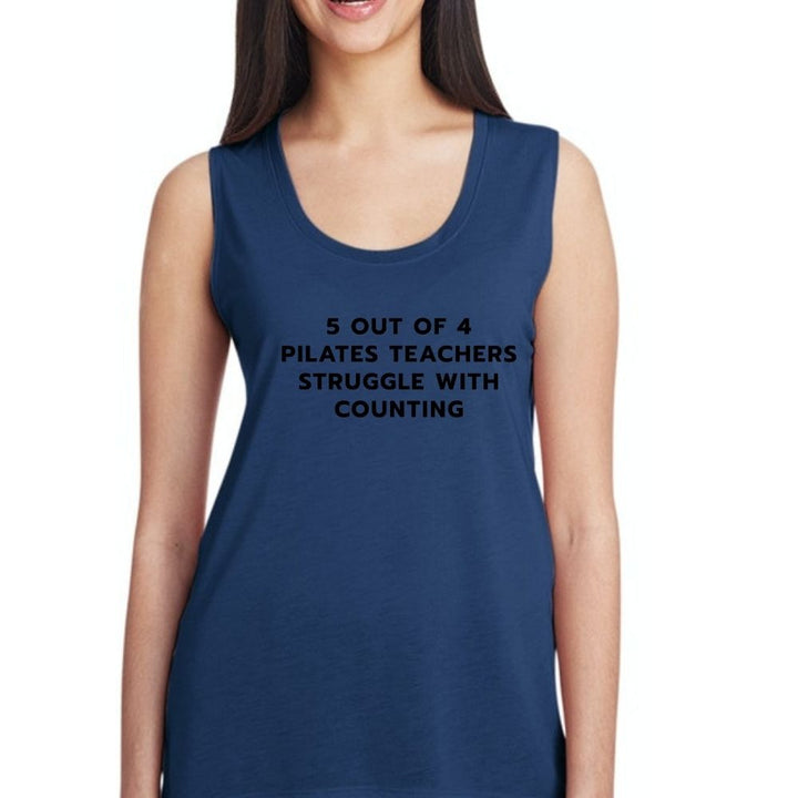 Woman wearing blue muscle Tank Top that says " 5 out of 4 Pilates Teachers Struggle With Counting" in black text