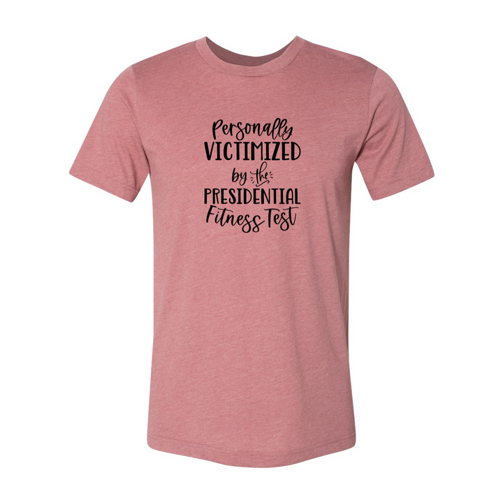 A mauve unisex crewneck t-shirt that says "Personally Victimized by the president fitness test"