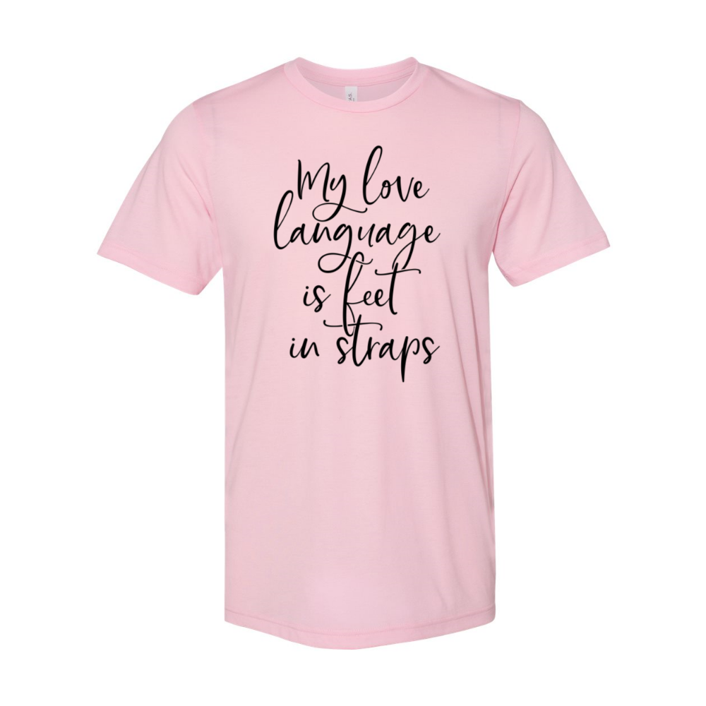 A heather pink unisex crewneck t-shirt that says "My Love Language Is Feet In Straps" in black script