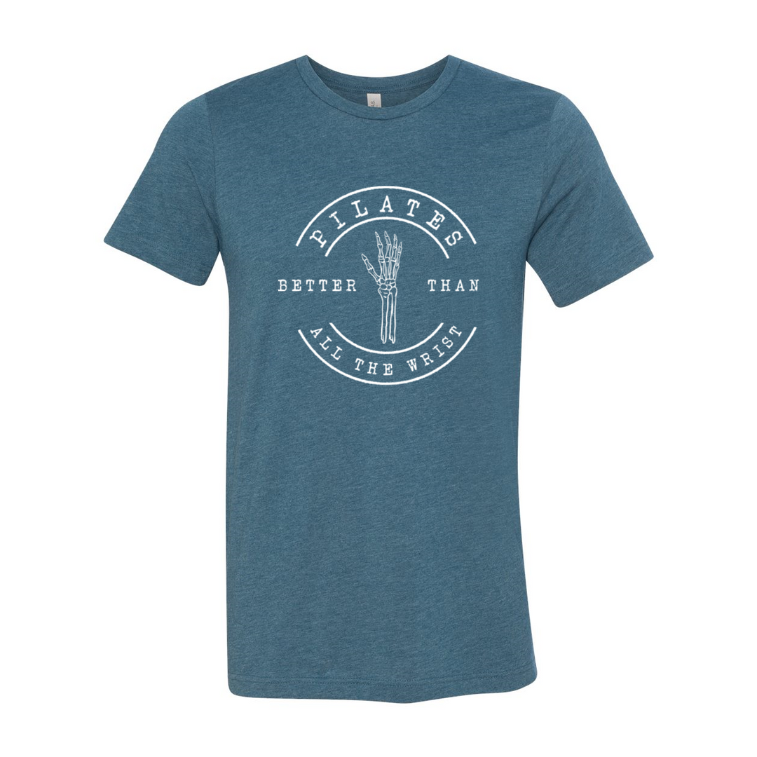 Heather teal unisex crew t-shirt with the words "Pilates better than all the wrist" in white text. There is a skeleton wrist incorporated into the text. 