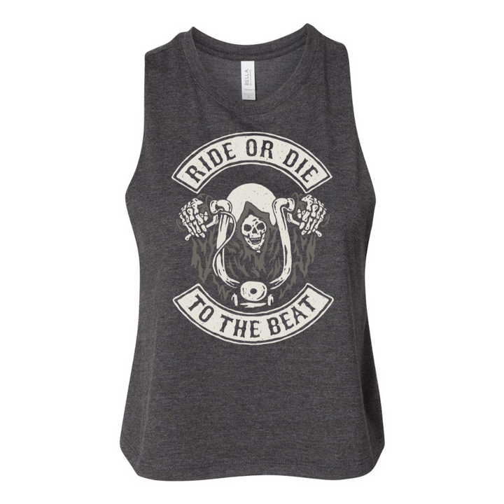 Woman holding weights wearing a crop top that says "ride or die to the beat" in a semi circle with a skeleton riding a motorcycle