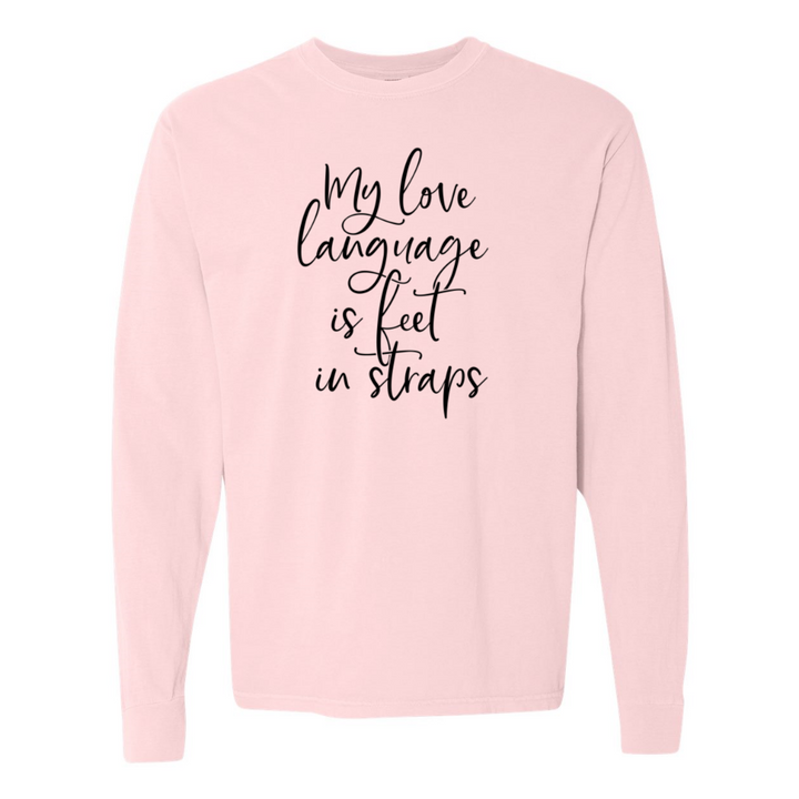 Unisex crew neck long sleeved shirt that says "My Love Language Is Feet In Straps" in black script