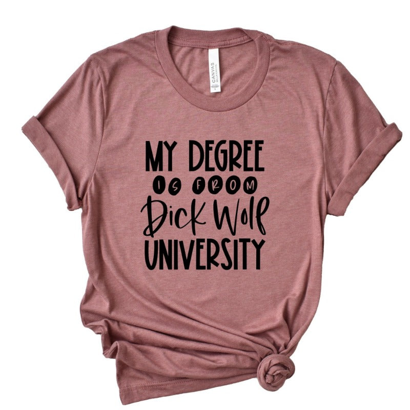 Heather mauve unisex crew neck blue t-shirt that says "my degree is from dick wolf university" in black text