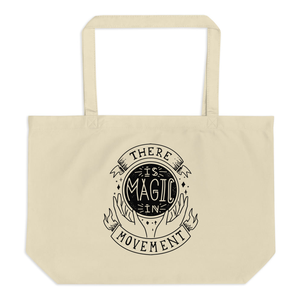 Canvas tote with handles that says "There is Magic In Movement" in black text. It is designed to look like crystal ball. 