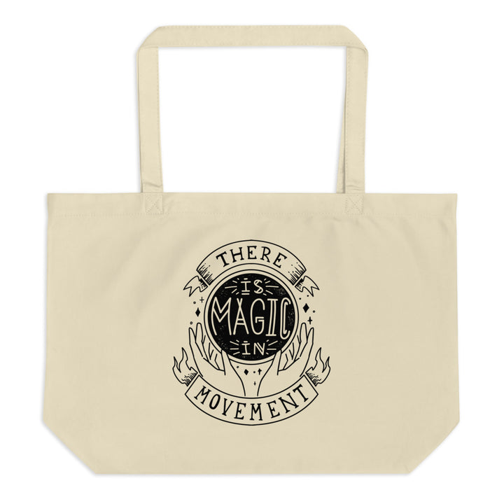 Canvas tote with handles that says "There is Magic In Movement" in black text. It is designed to look like crystal ball. 