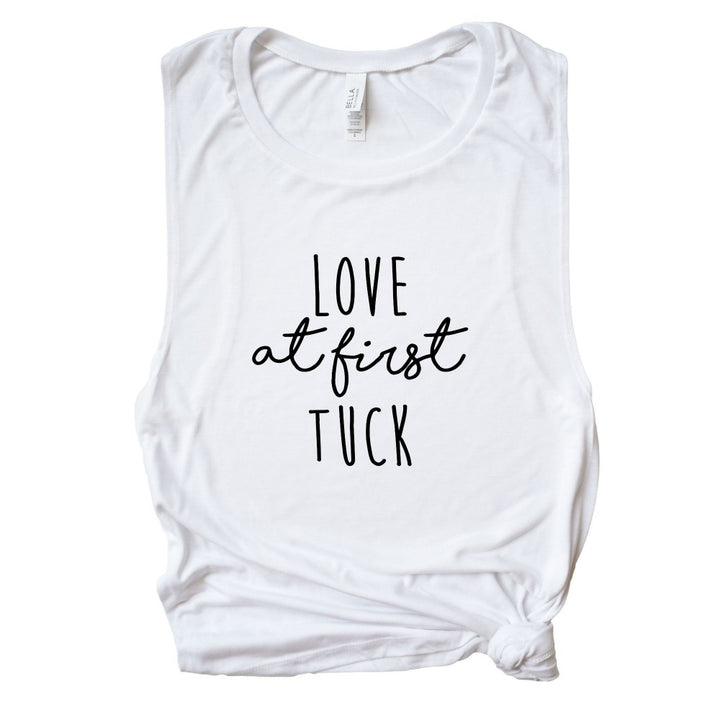 White women's Cut Muscle Tank Top that says "love at first tuck" in black text