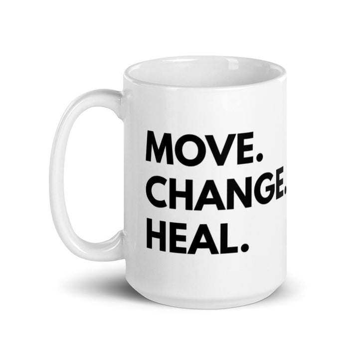 15 oz mug  that says Move. Change. Heal. in black text