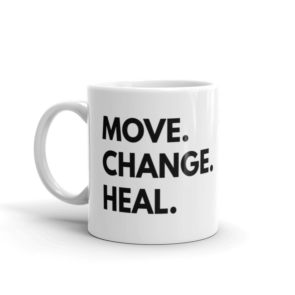11 oz mug  that says Move. Change. Heal. in black text