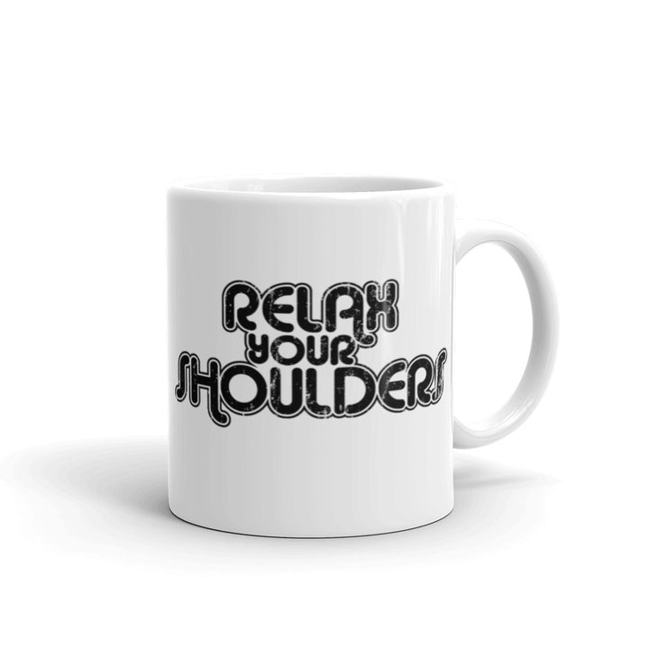 11oz white coffee mug that says "Relax Your Shoulders" in black retro font