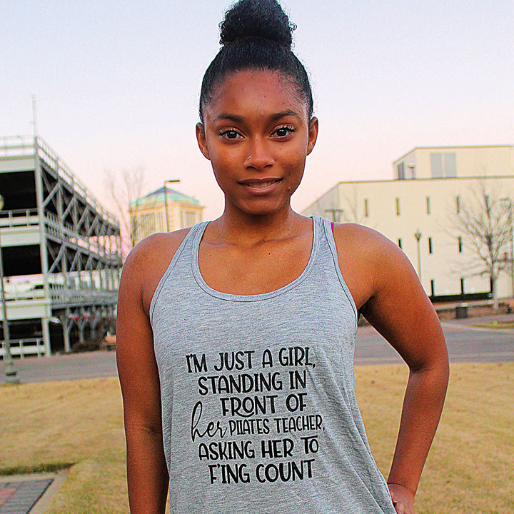 Grey Racerback Tank Top that says "I'm just a girl, standing in front of her pilates teacher, asking her to f'ing count"