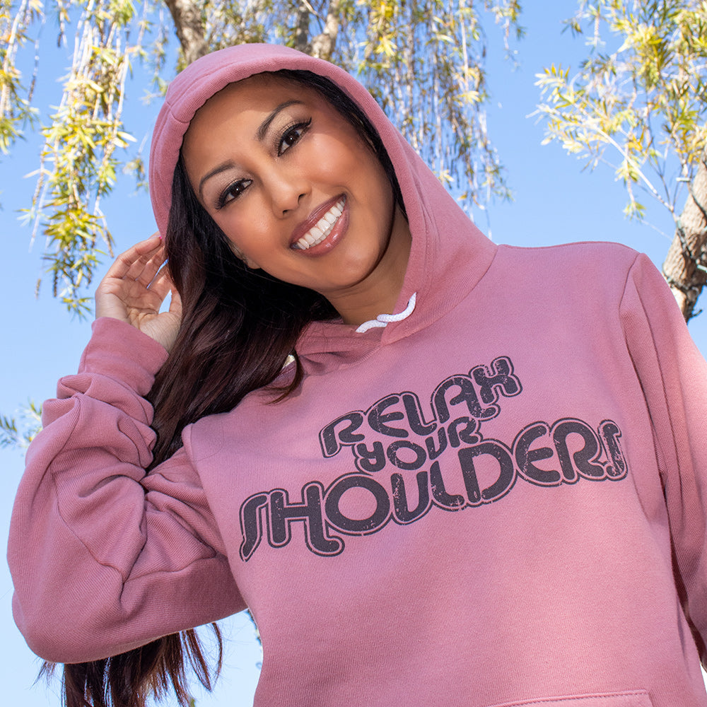 Unisex Mauve Fleece hoodie that says "relax your shoulders" in black retro vibe text
