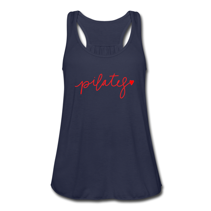 Woman wearing a blue racerback tank top that says Pilates and at the end of the s there is a heart 