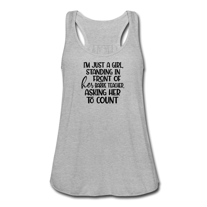 Women wearing a grey racerback tank top that says "i'm just a girl, standing in front of her barre teacher, asking her to count"