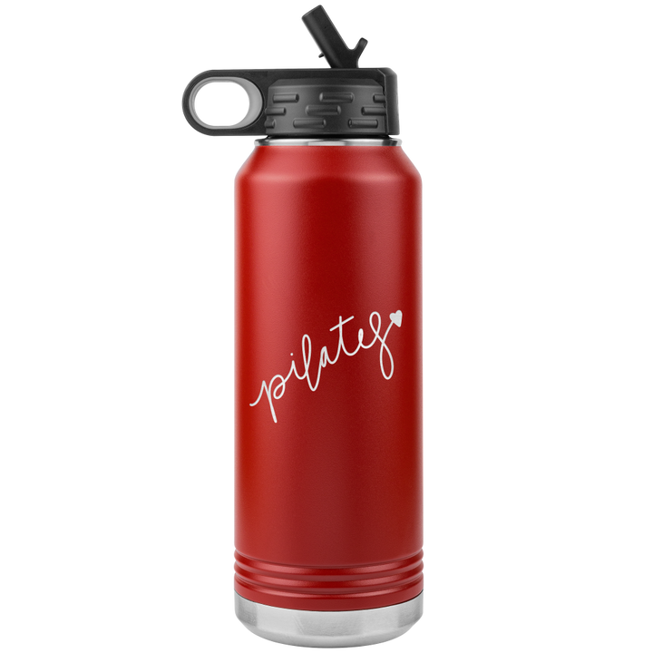 32 oz red water bottle that has the words Pilates laser etched on one side, with a heart at the end of the word "Pilates"