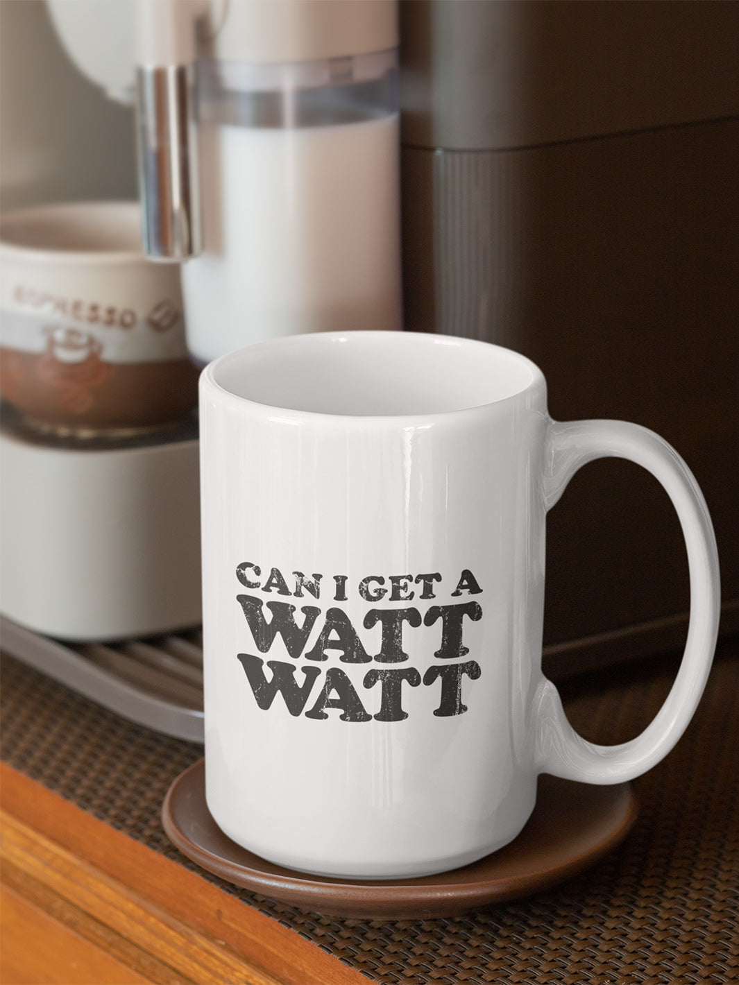 15 oz. white coffee mug that says "Can I Get A Watt Watt" in retro style all caps text