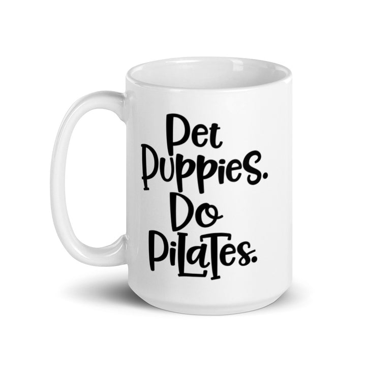 15oz white mug that has the words "Pet Puppies. Do Pilates" on the front.