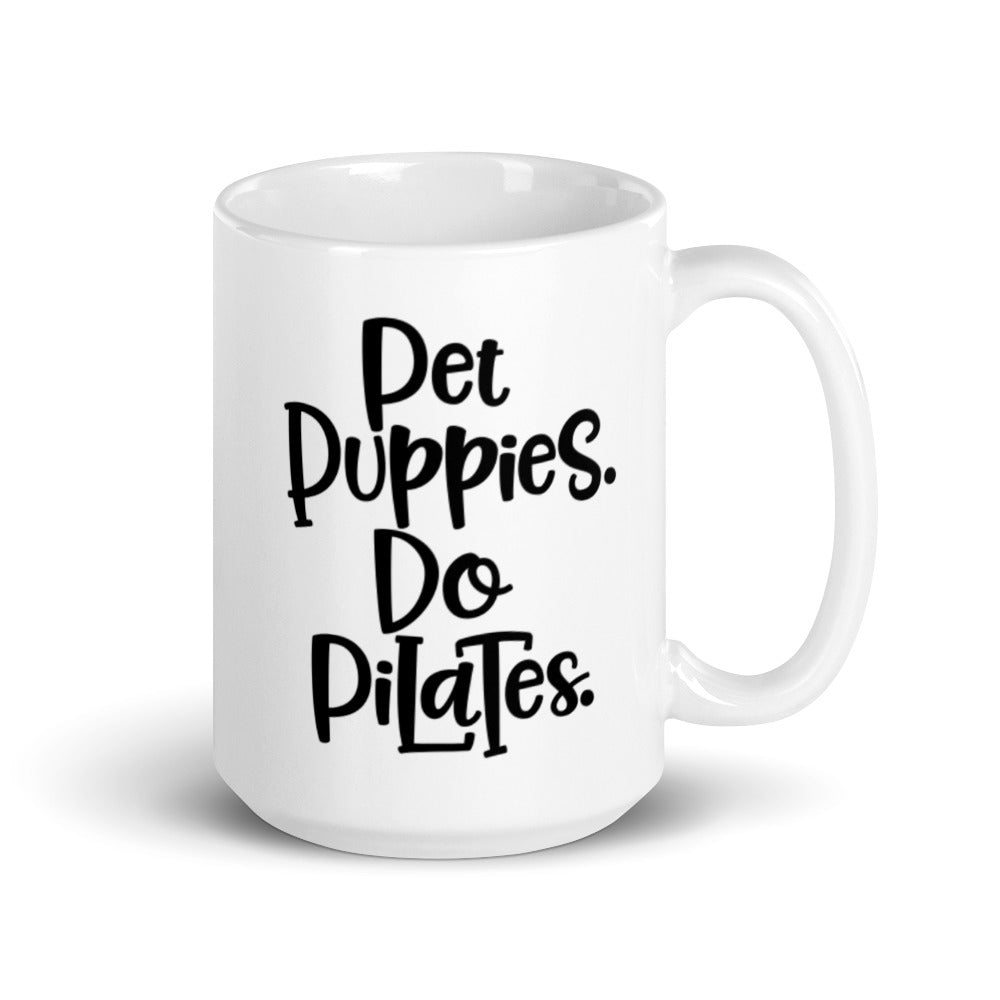 15oz white mug that has the words "Pet Puppies. Do Pilates" on the front.